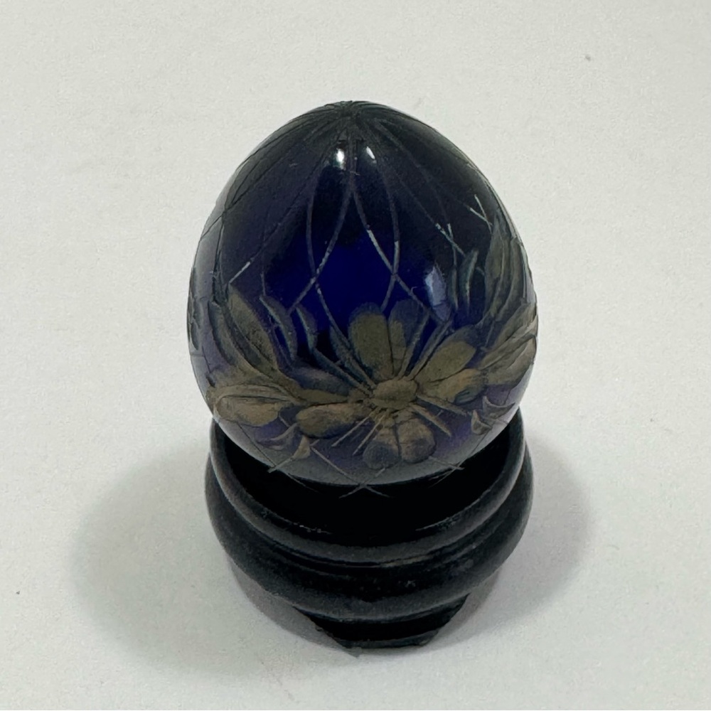 Fabergé-style glass egg with an etched royal crown and floral design